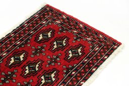 Surface texture of 2000s Torkaman rug with natural Wool and intricate pattern
