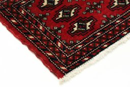 Backside of handmade 2000s Torkaman rug showing knot structure and weave density