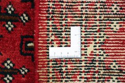 Close-up detail of 2000s Torkaman rug from Iran / Persia showing Wool weave