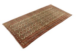 Corner detail of 1990s Torkaman rug showing border pattern and Wool pile