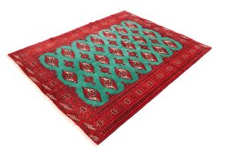 Corner detail of 1990s Torkaman rug showing border pattern and Wool pile