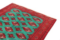 Surface texture of 1990s Torkaman rug with natural Wool and intricate pattern