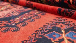 Close-up detail of 1940s Wiss rug from Iran / Persia showing Wool weave