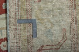 Backside of handmade 1950s Wiss rug showing knot structure and weave density