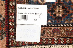Corner detail of 1990s Yalameh rug showing border pattern and Wool pile