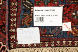 Corner detail of 1990s Yalameh rug showing border pattern and Wool pile