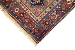 Backside of handmade 1990s Yalameh rug showing knot structure and weave density