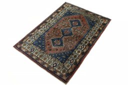 Corner detail of 2000s Yalameh rug showing border pattern and Wool pile