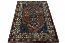 Surface texture of 2000s Yalameh rug with natural Wool and intricate pattern
