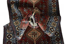 Close-up detail of 2000s Yalameh rug from Iran / Persia showing Wool weave