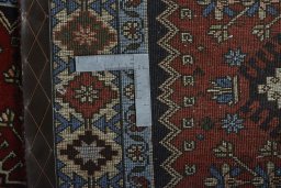 Surface texture of 2000s Yalameh rug with natural Wool and intricate pattern