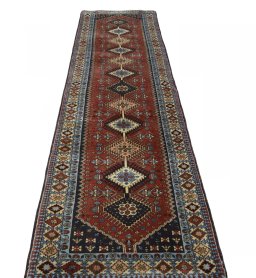 Surface texture of 2000s Yalameh rug with natural Wool and intricate pattern