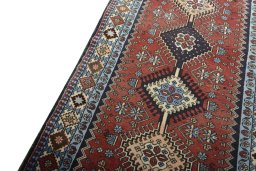 Backside of handmade 2000s Yalameh rug showing knot structure and weave density