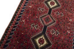Backside of handmade 2000s Yalameh rug showing knot structure and weave density