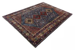 Corner detail of 1970s Yalameh rug showing border pattern and Wool pile