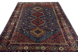 Surface texture of 1970s Yalameh rug with natural Wool and intricate pattern