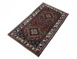 Corner detail of 2000s Yalameh rug showing border pattern and Wool pile