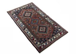 Close-up detail of 2000s Yalameh rug from Iran / Persia showing Wool weave