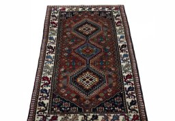 Surface texture of 2000s Yalameh rug with natural Wool and intricate pattern