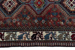 Close-up detail of 2000s Yalameh rug from Iran / Persia showing Wool weave