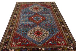 Surface texture of 1970s Yalameh rug with natural Wool and intricate pattern