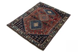 Corner detail of 1970s Yalameh rug showing border pattern and Wool pile