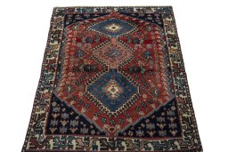 Surface texture of 1970s Yalameh rug with natural Wool and intricate pattern
