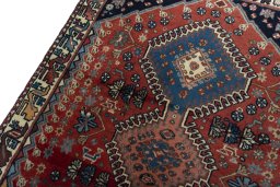 Backside of handmade 1970s Yalameh rug showing knot structure and weave density