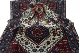 Corner detail of 2000s Yalameh rug showing border pattern and Wool pile