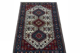 Surface texture of 2000s Yalameh rug with natural Wool and intricate pattern