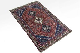 Close-up detail of 2000s Yalameh rug from Iran / Persia showing Wool weave