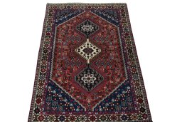 Surface texture of 2000s Yalameh rug with natural Wool and intricate pattern