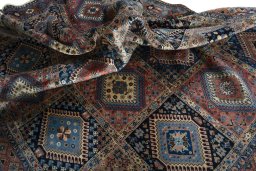 Corner detail of 2000s Yalameh rug showing border pattern and Wool pile