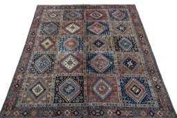 Surface texture of 2000s Yalameh rug with natural Wool and intricate pattern