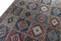 Backside of handmade 2000s Yalameh rug showing knot structure and weave density