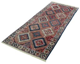 Corner detail of 2000s Yalameh rug showing border pattern and Wool pile