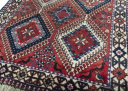 Central medallion detail of 2000s Yalameh rug from Iran / Persia