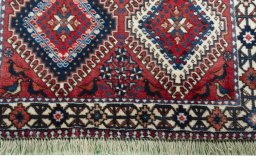 Close-up detail of 2000s Yalameh rug from Iran / Persia showing Wool weave