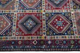 Close-up detail of 2000s Yalameh rug from Iran / Persia showing Wool weave