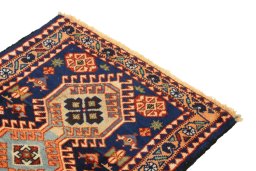 Surface texture of 1990s Yalameh rug with natural Wool and intricate pattern