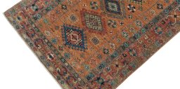 Backside of handmade New Kazak rug showing knot structure and weave density
