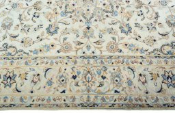 Corner detail of New Kashan rug showing border pattern and Wool pile