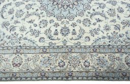 Corner detail of 2000s Nain rug showing border pattern and Wool pile