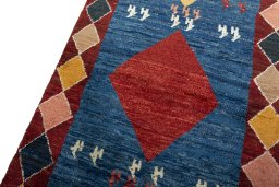 Backside of handmade 2000s Persian Gabbeh rug showing knot structure and weave density