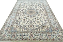 Surface texture of 2000s Nain rug with natural Wool and intricate pattern