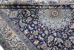 Close-up detail of 2000s Nain rug from Iran / Persia showing Wool weave