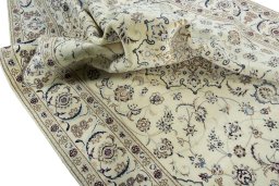 Surface texture of 2000s Nain rug with natural Wool and intricate pattern