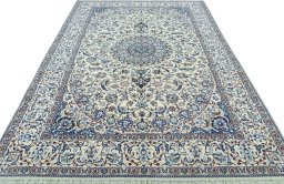 Surface texture of 2000s Nain rug with natural Wool and intricate pattern