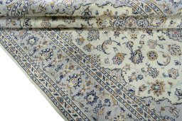 Close-up detail of New Kashan rug from Iran / Persia showing Wool weave
