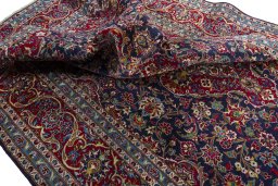 Surface texture of 2000s Kashan rug with natural Wool and intricate pattern